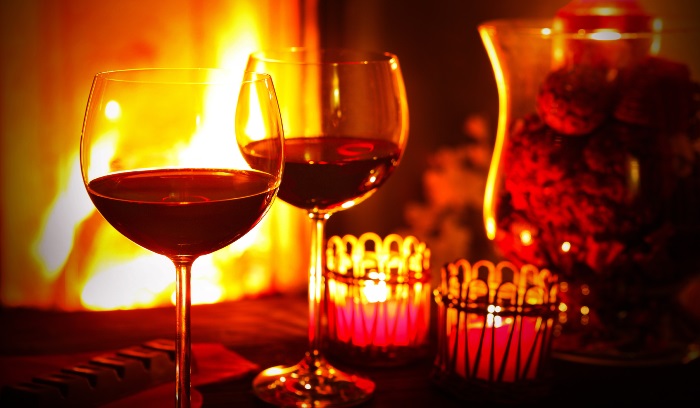 Red wine by the fireplace